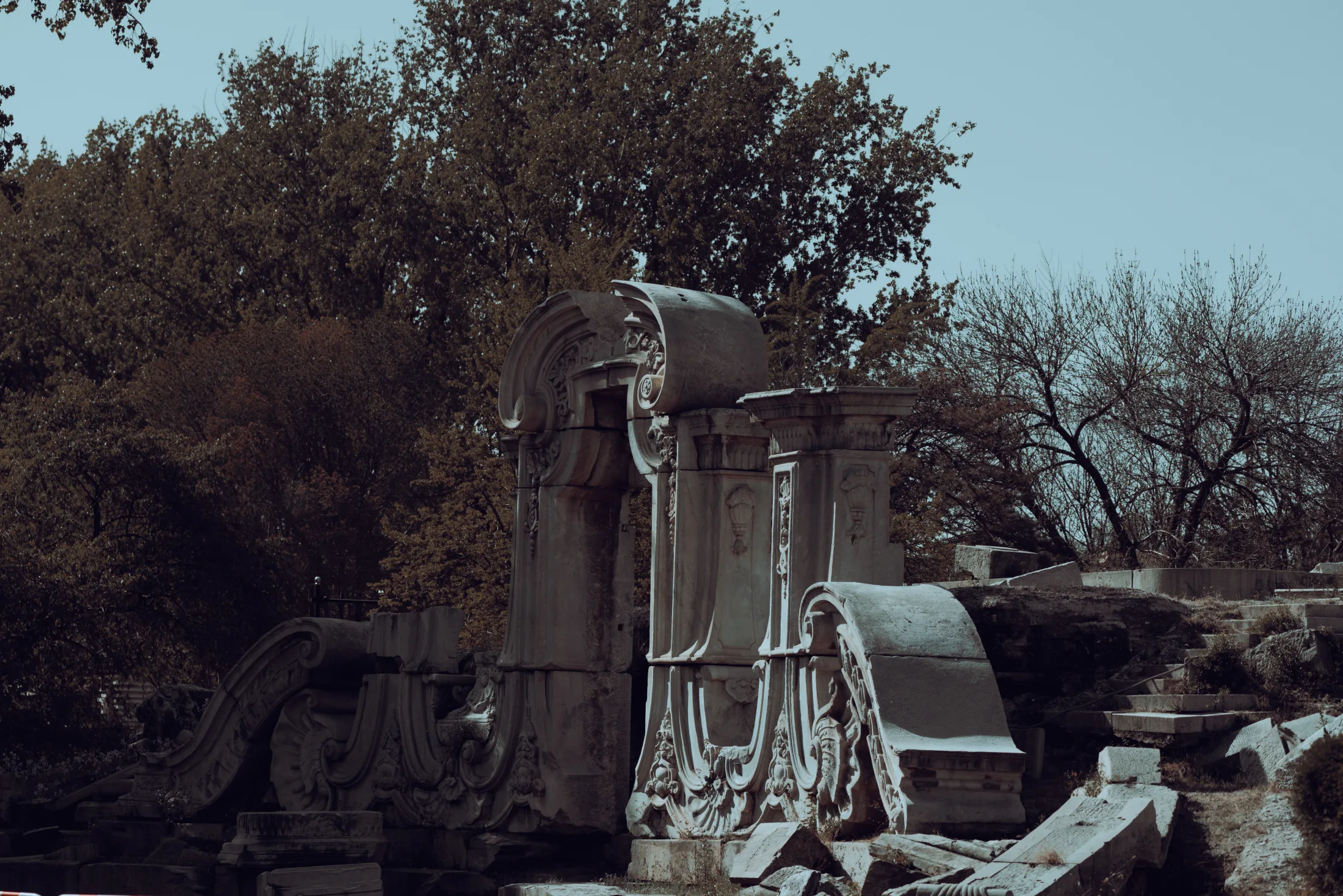 Historic stonework among trees in Beijing