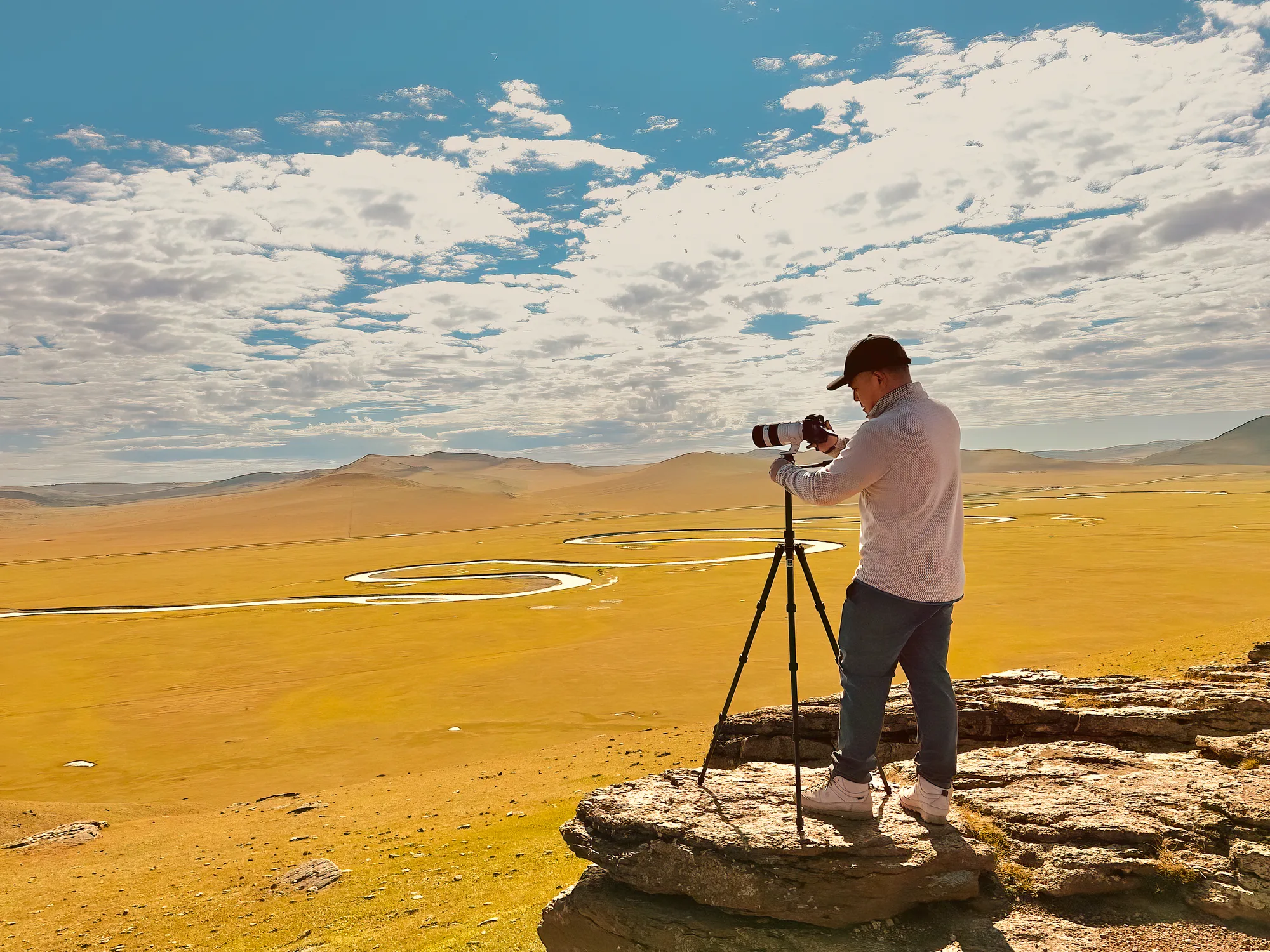 Wang Peng photographing a landscape